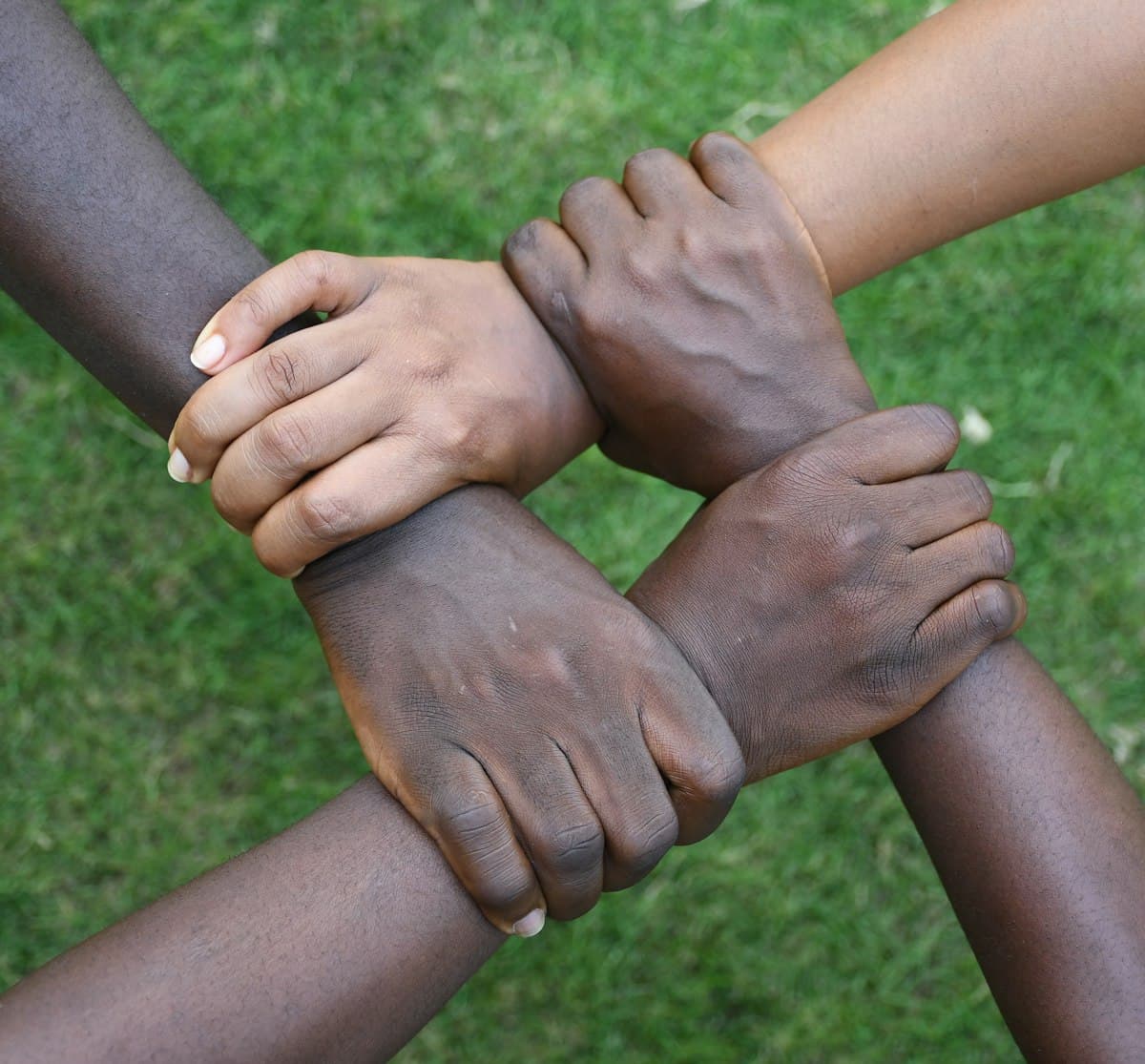 Hands joined together — trust is at the heart of every savings circle